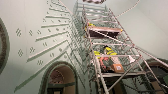 Conservators using scaffold to conserve the Octagon, A la Ronde, Devon.